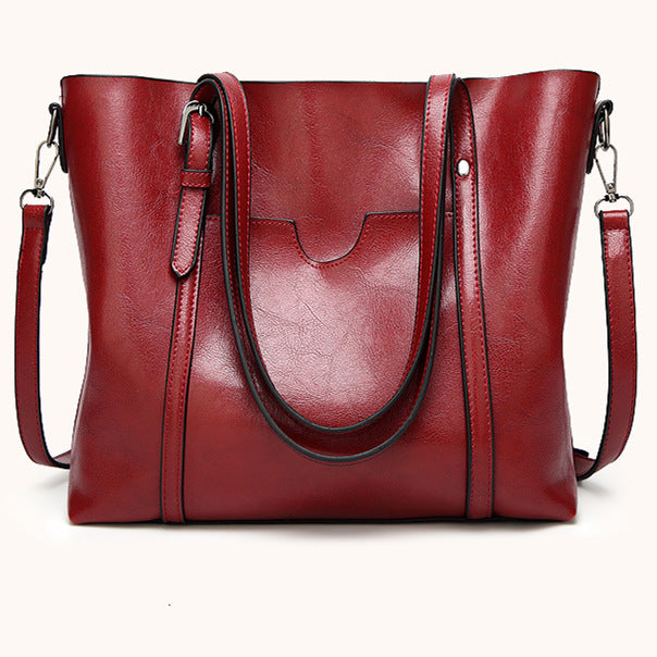 Very spacious, made of soft imitation leather – simple and versatile